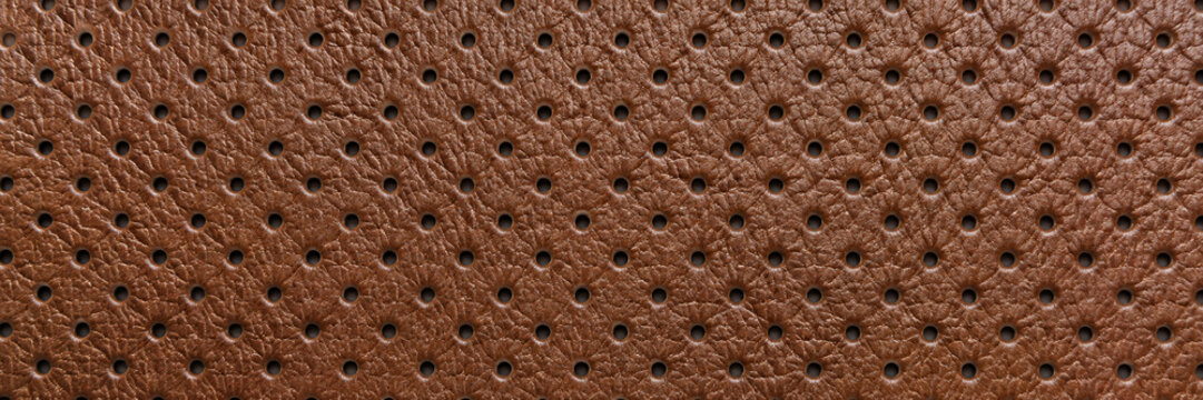 Brown leather perforation pattern with textured holes  