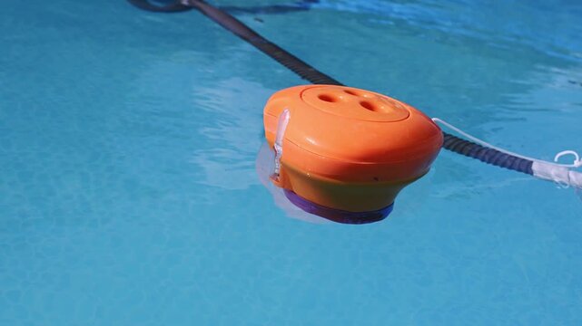 Floating orange pool thermometer for outdoor summer use