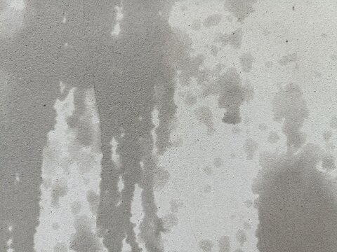 grunge wall background, Old cement wall texture, wet cement wall, creating a pattern, light and dark grey, flow of water from high to low, image of water distribution from splashing.