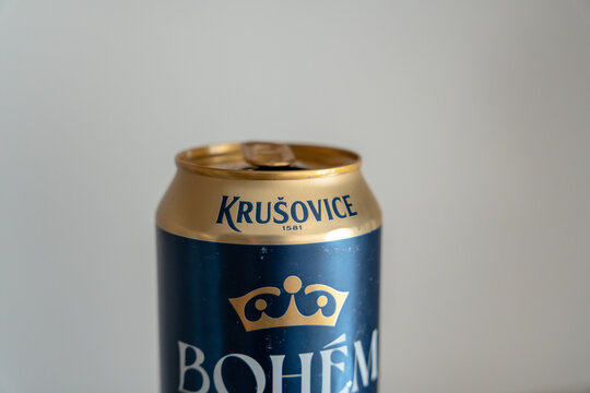 Warsaw, Poland - Sep 20, 2026: Top of a Krusovice Bohem beer can with the gold lid, ring pull and brand crown emblem photographed from a low angle against a grey background