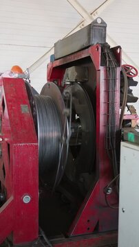 Machine unwinding steel wire from a large coil on a rebar production line