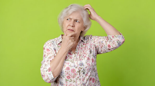Confused Senior Woman Pondering and Scratching Head.
