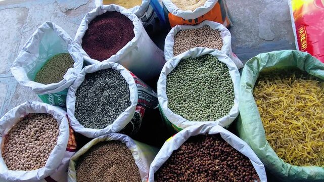 Open sacks of diverse Indian pulses and grains captured in a vibrant market display showcasing agricultural diversity, traditional food staples, and healthy organic grocery choices.