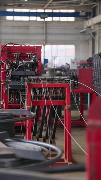 Welding machine producing steel reinforcement mesh in a factory hall