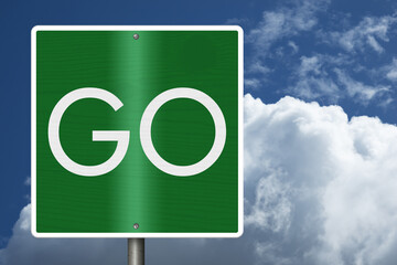 Green Go sign with sky © Karen Roach