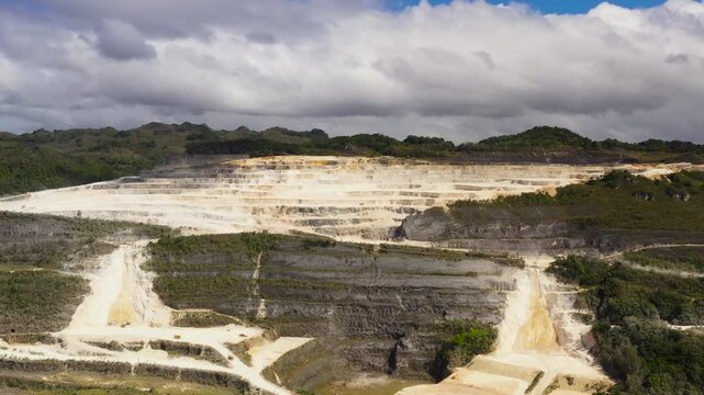 A multi-level limestone quarry in the mountainous part of Bohol Island, Philippines.