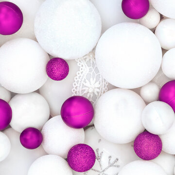 Purple white red Christmas sparkling tree decorations with sphere shape balls background. Festive symbols for the holiday season greeting card