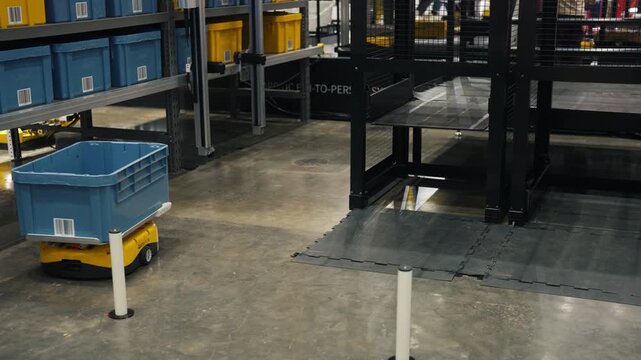 Modern freight transportation and automated cargo handling inside industrial building.