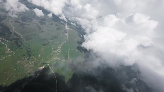 Aerial view of green landscape and clouds