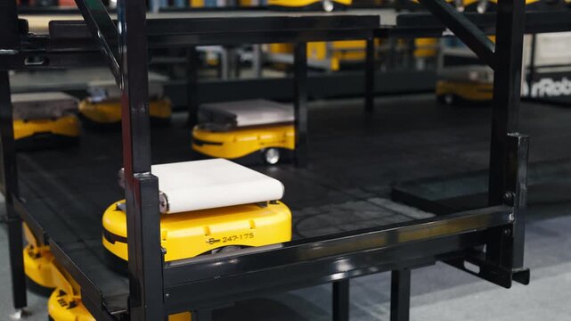 Driverless transport and AGV robots moving cargo inside smart logistics facility.