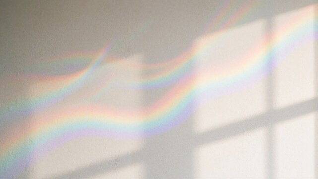 Rainbow light refraction and window shadows on white wall