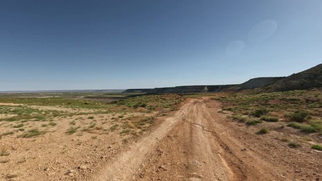 Dirt road winding through arid landscape
