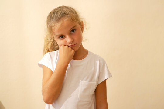 Young girl looking bored and unhappy pouting indoors