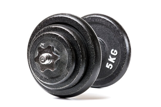 Adjustable iron dumbbell with heavy black cast iron weight plates on threaded steel bar close-up isolated on white background. Perfect for strength training, bodybuilding, fitness workouts.