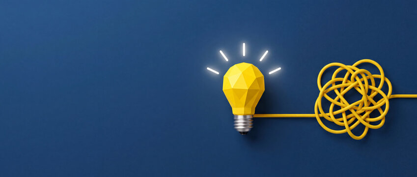 Bright yellow polygonal lightbulb glowing on a deep blue background connected to a tangled wire, representing creative solutions, simplifying complex problems, and innovative brainstorming concepts.