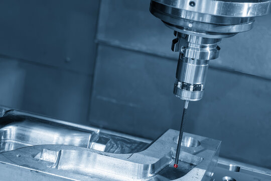 Mold parts quality control by CMM probe measurement on a CNC milling machine in a blue tone scene