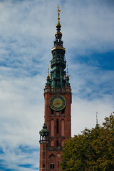 Historic Gdańsk Town Hall Tower with Clock and Ornate Green Spire, Poland © Klaudia Florczak 