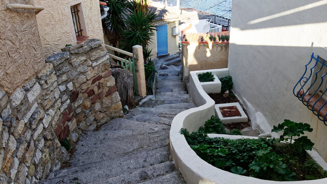 The Mediterranean charm of a stone staircase leading to the delightful narrow streets of Anse de M&eacute;jan, in Provence (Toulon).