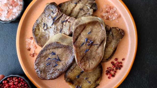 Slices of grilled pork or beef tongue seasoned with salt and allspice. Sliced beef tongue as a food background for your design