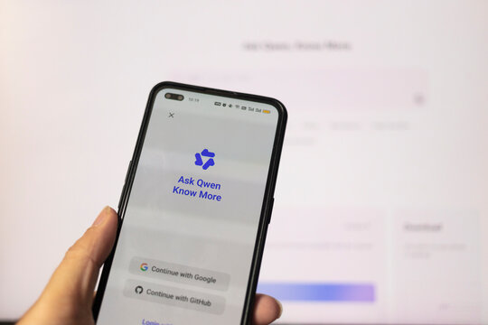 Person Using Qwen Artificial Intelligence App On Smartphone