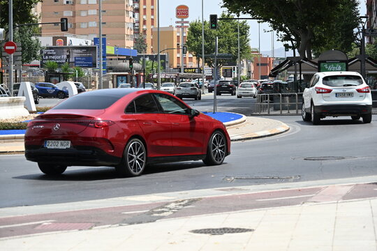 Red Mercedes-Benz CLA on a Roundabout in Spain