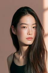 Fototapeta premium Beautiful young Asian woman model with natural skincare and long dark hair