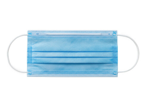A single blue disposable surgical face mask with ear loops, isolated on a black background, representing health safety and protection isolated on a transparent background