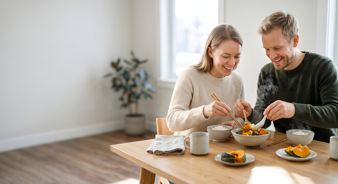 Caucasian couple enjoying warm simmered pumpkin dish in a cozy dining room