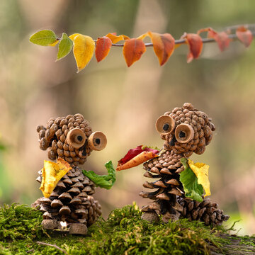 nature handcrafted autumn figures from acorns and pine cones in autumn