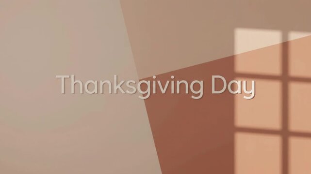 Minimalist "Thanksgiving Day" text on a warm beige and brown geometric background with window shadow casting