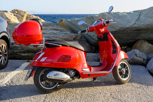 Andros, Greece - May 12, 2026: Vespa GTS Super by the sea on the Greek island of Andros