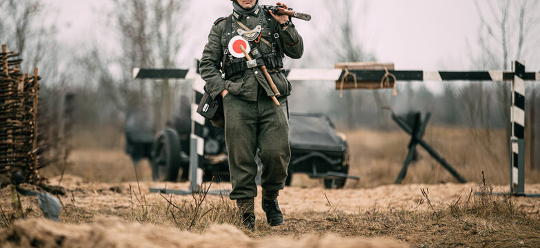 German Wehrmacht Soldier Walking Past Checkpoint Barrier Eastern Front WWII Reenactment