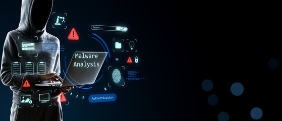 Plakat Anonymous hooded hacker analyzing malware on laptop with cybersecurity interface, authentication and protection icons on dark copy space background.