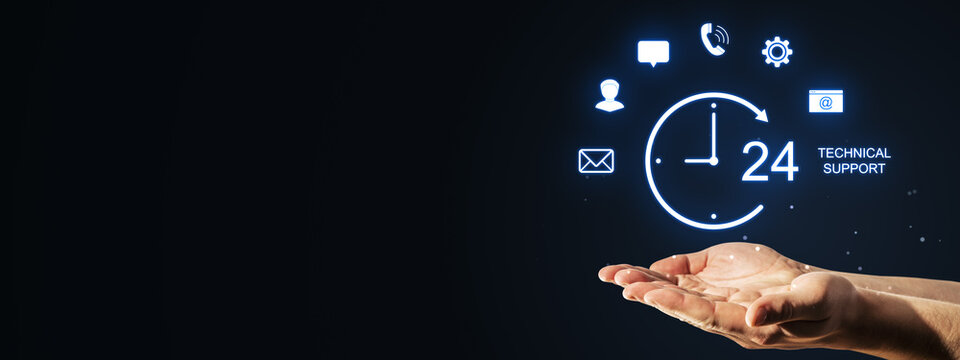 24-hour technical support concept with glowing hologram icons above an open businessperson hand on dark blue technology background for marketing.