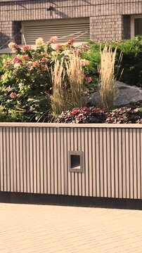 Dubai courtyard features landscaped planter beside residential tower