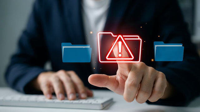 Hand touching a digital folder icon with a red warning symbol and surrounding folders data file
