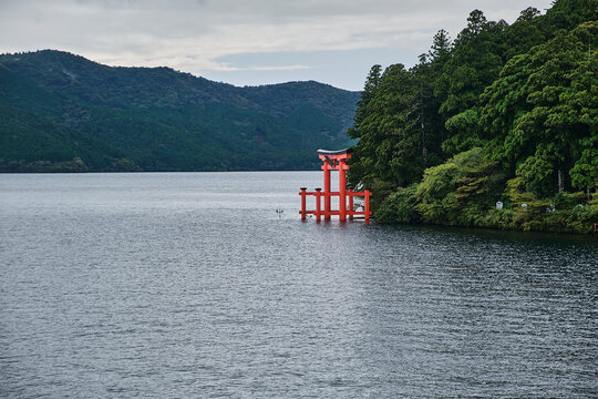 A Japanese Shinto shrine gate also known as a Torii on Lake Ashi