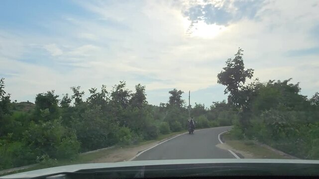 Rural Path Leading Toward Green Village