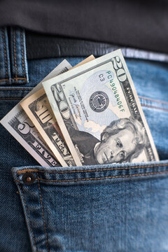 US dollars in the back pocket of a pair of jeans.
