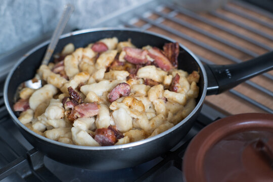 Kopytka &ndash; in Polish cuisine, a type of thick, diamond-shaped dumpling made from boiled potatoes, flour, and eggs.
