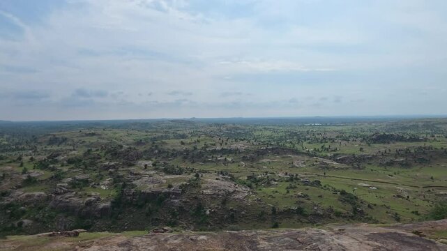 Panoramic Green Valley Beneath Cloudy Sky