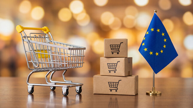Miniature shopping cart, stacked boxes with cart icon, and EU flag on wooden surface, symbolizing commerce and European trade