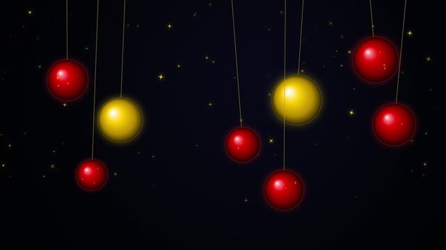 Floating red and yellow spheres with string on black background festive decoration