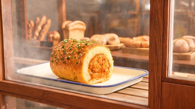 Pork Floss Roll with Scallions and Sesame in a Bakery Display Case