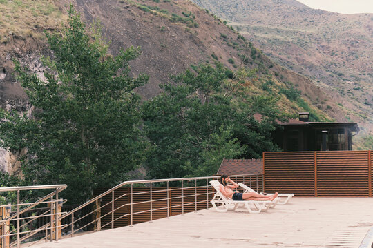 Relaxation by the mountainside near a wooden deck in nature