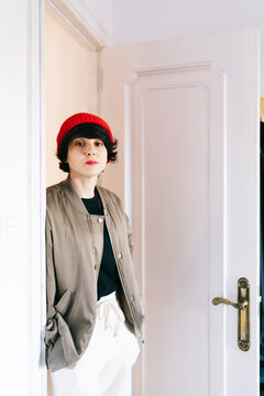 Woman standing in doorway of creative home studio