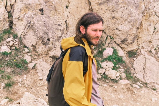 Man hiking in rocky terrain during daytime in nature
