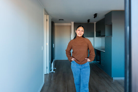 Young woman in modern apartment