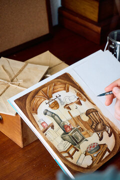 Hand drawing fine details on watercolor interior illustration