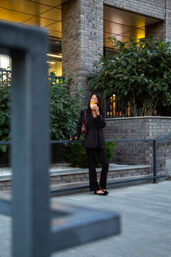 Businesswoman taking break outdoors with coffee